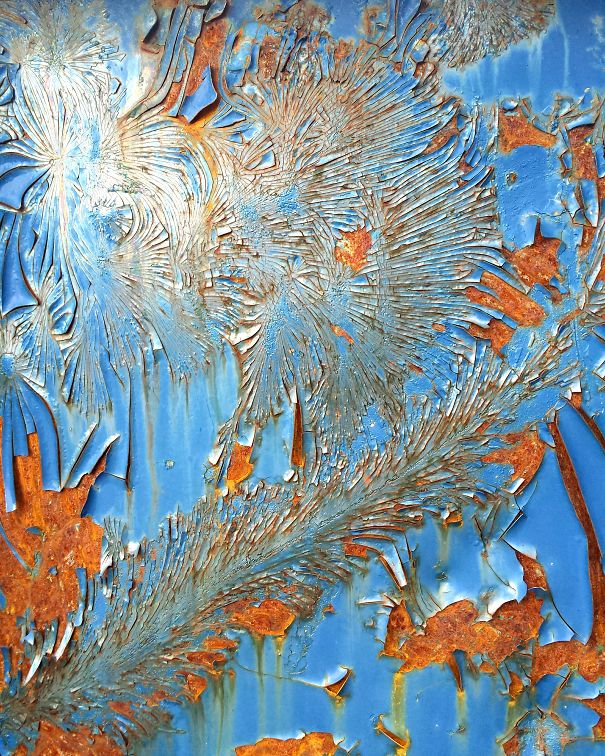 Old Paint On A Rusted Container