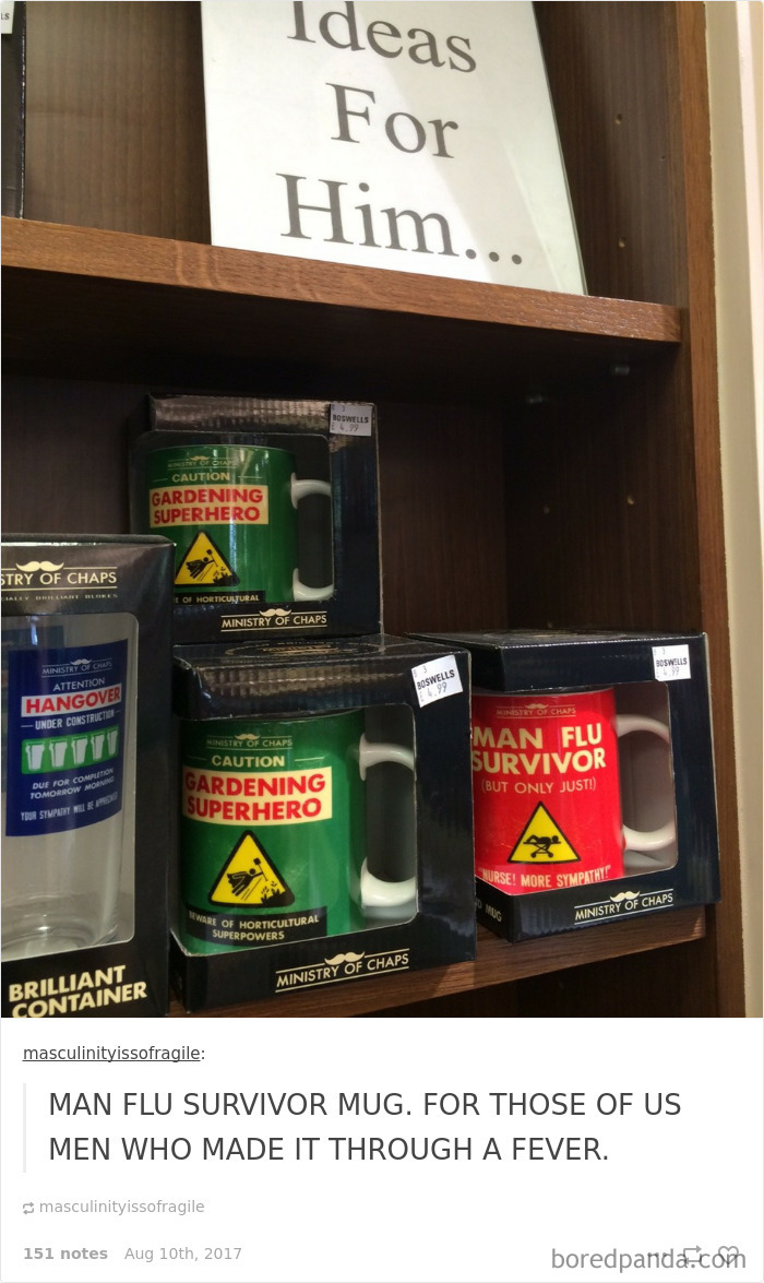 Husband-themed mugs in gift shop, including a "Man Flu Survivor" mug humorously showcasing husbands catching a cold.