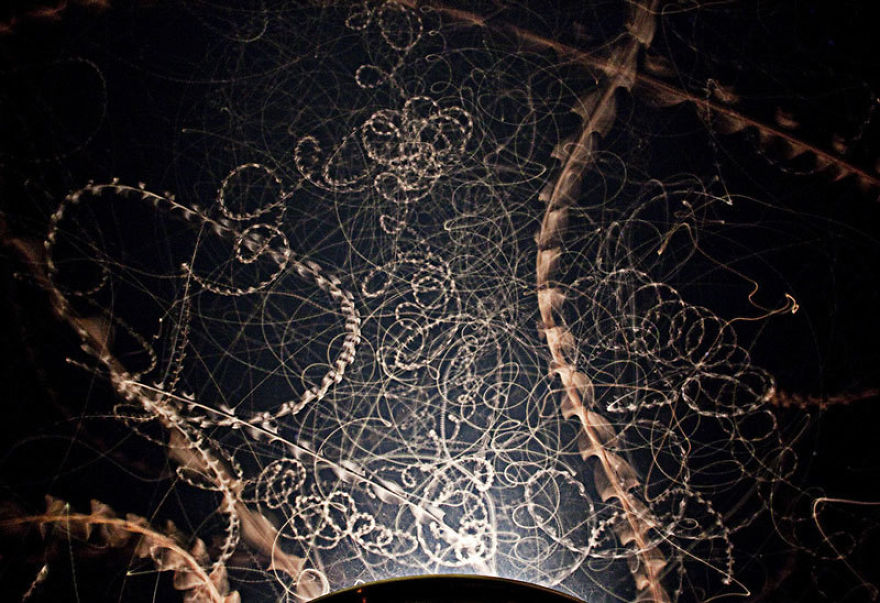 Long-exposure Capture Of Moths Swarming A Light At Night