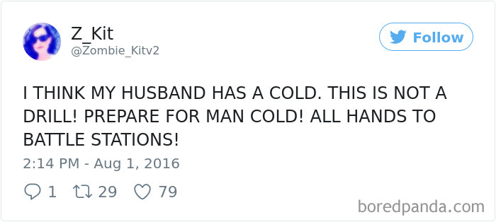 Tweet humorously exaggerating a husband's reaction to having a cold, implying it's a "man cold" emergency.