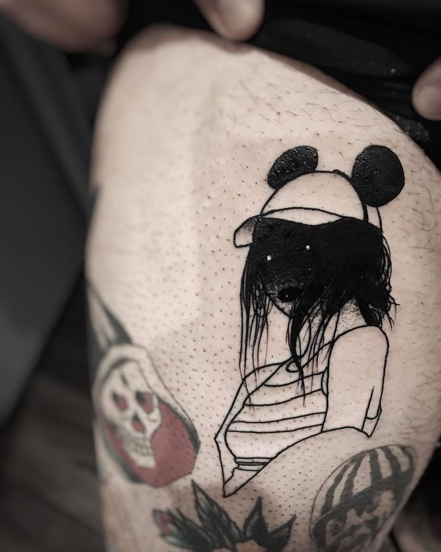 Tattoo of a faceless girl with a hat, featuring slightly erotic design elements on skin.