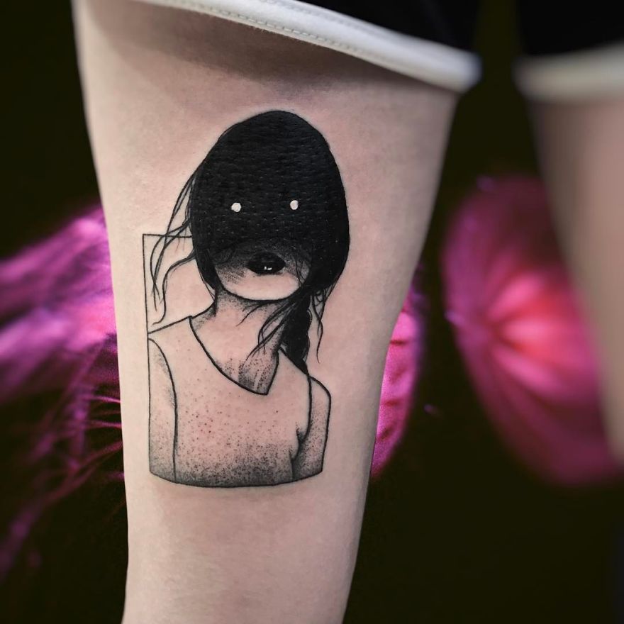 Tattoo of a faceless girl with a dark, abstract design on the skin, providing a slightly erotic artistic impression.