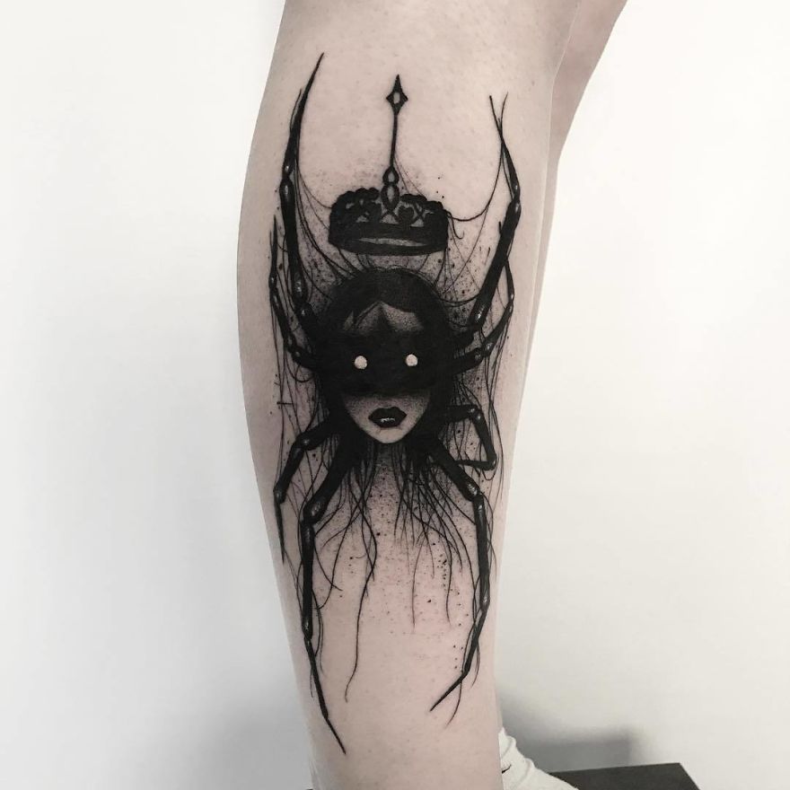 Tattoo of a faceless girl with a crown and spider elements on leg, with an artistic, slightly erotic style.