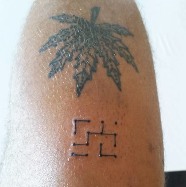 Tattoo by a Brazilian artist featuring a leaf and abstract geometric design on skin.