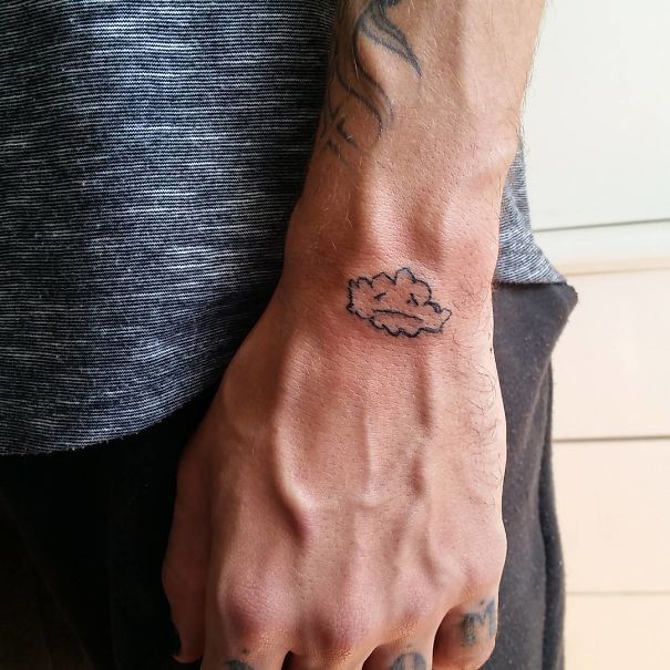 Unique tattoo on a person's hand by a Brazilian artist known for unconventional designs.