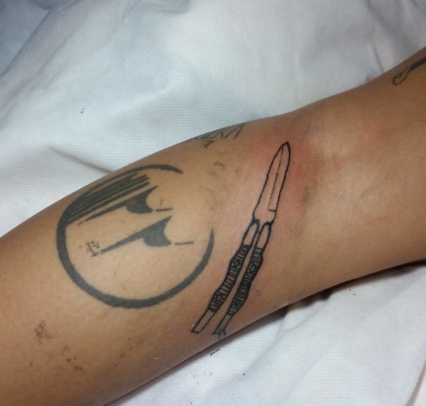Brazilian tattoo with unique pen drawing design on arm.