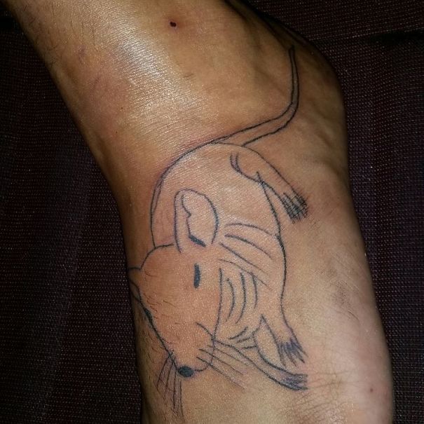 Tattoo of a simplistic mouse design on a foot by a Brazilian tattoo artist known for unique drawing style.