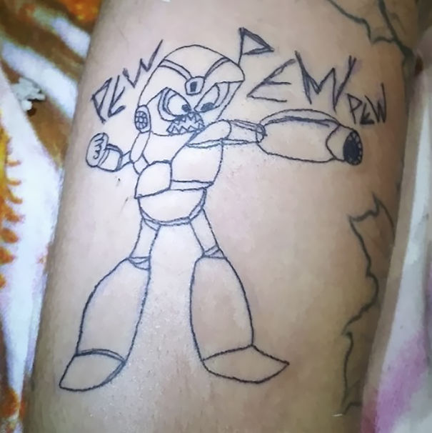 Amateur drawing of a robot tattoo by Brazilian artist, with "pew pew" text.