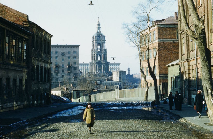 A Child Walks Through A Run-Down Street In Moscow Near The Moskva River 