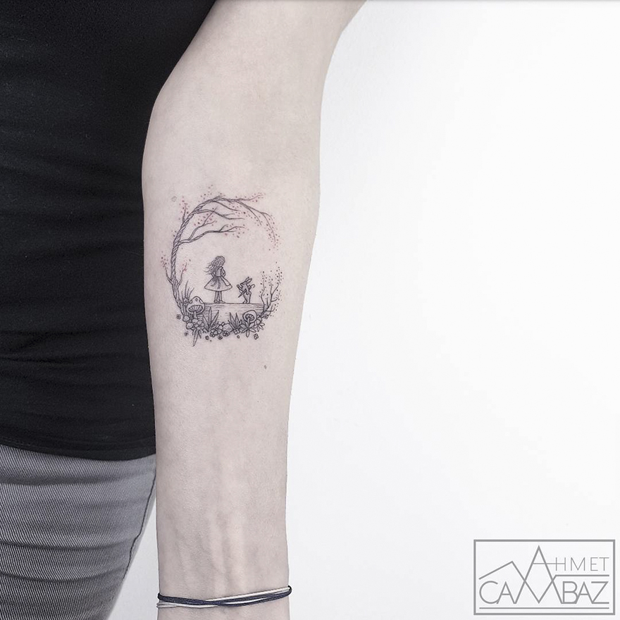 Minimalist tattoo by Turkish cartoonist, featuring a girl and rabbit in a nature setting on a person's arm.