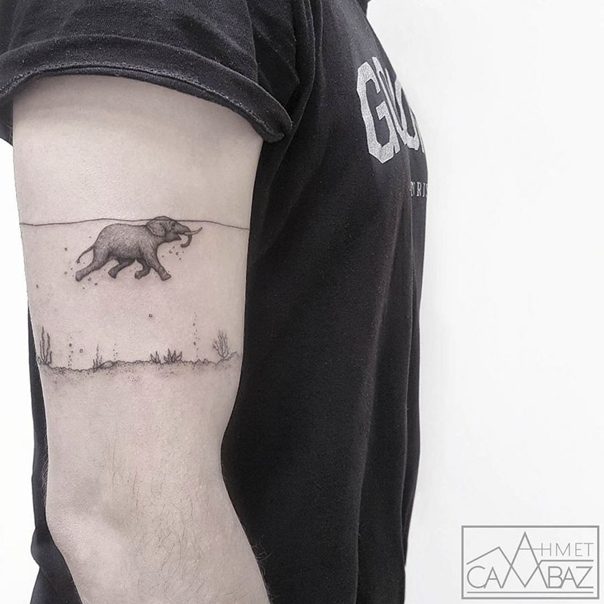 Simple elephant tattoo on arm by Turkish cartoonist.