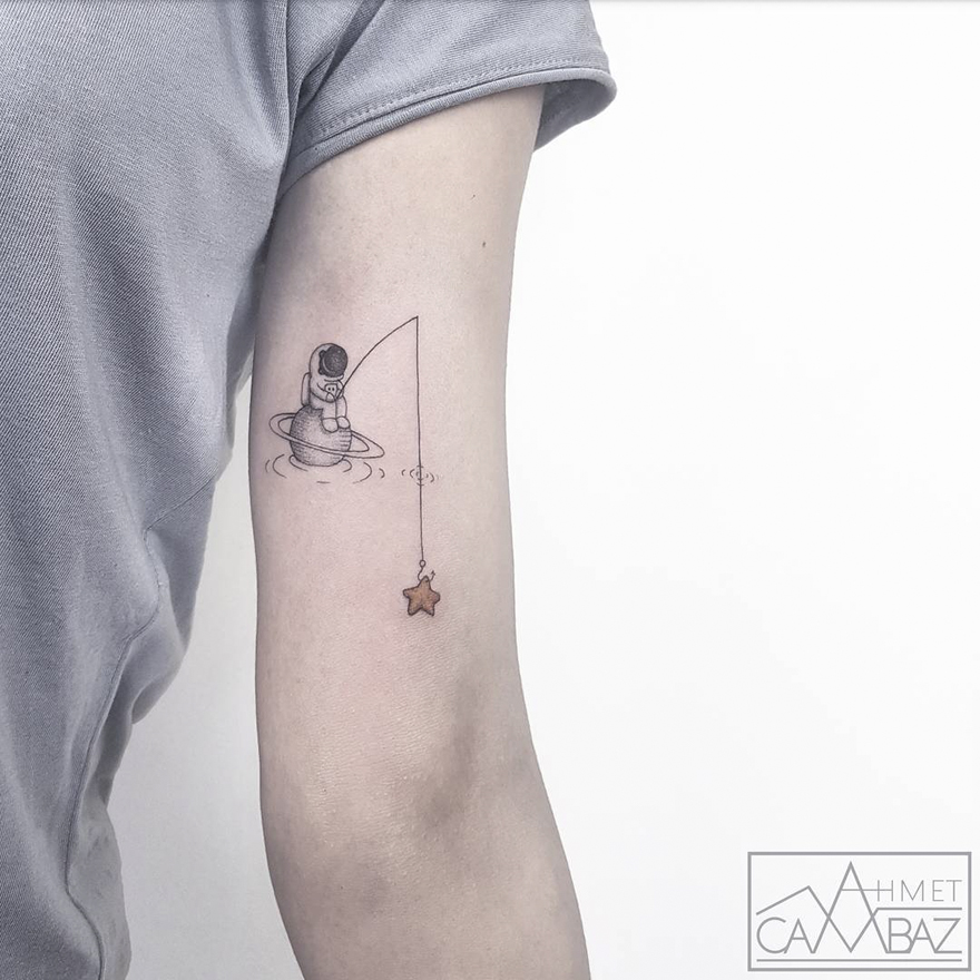 Simple yet striking tattoo of an astronaut fishing for a star on someone's arm.