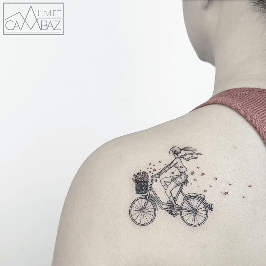 Unique tattoo of a woman cycling, designed by a former Turkish cartoonist, on a person's shoulder.