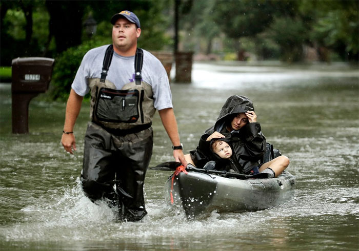 People Evacuate A Neighborhood In West Huston
