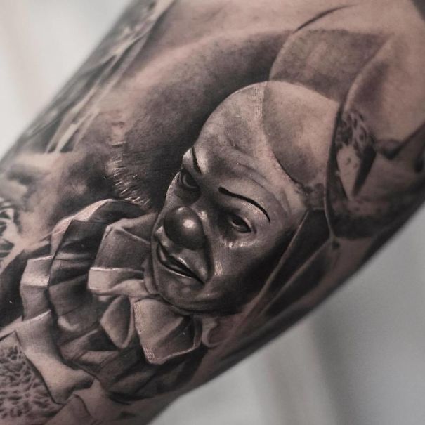 Realistic tattoo of a clown on skin, crafted by a Belgian tattooist.