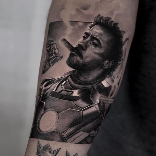 Realistic tattoo of a person in armor smoking a cigar, showcasing detailed artistry by a Belgian tattooist.
