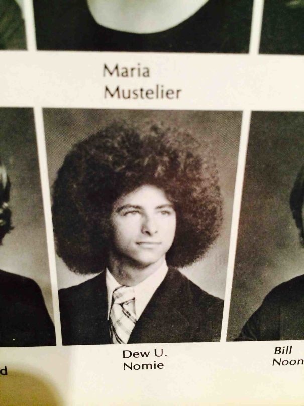 a man with curly hair in the yearbook 