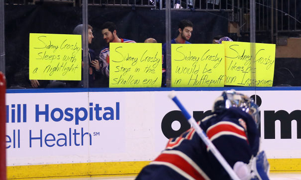 men holding Sidney Crosby signs 
