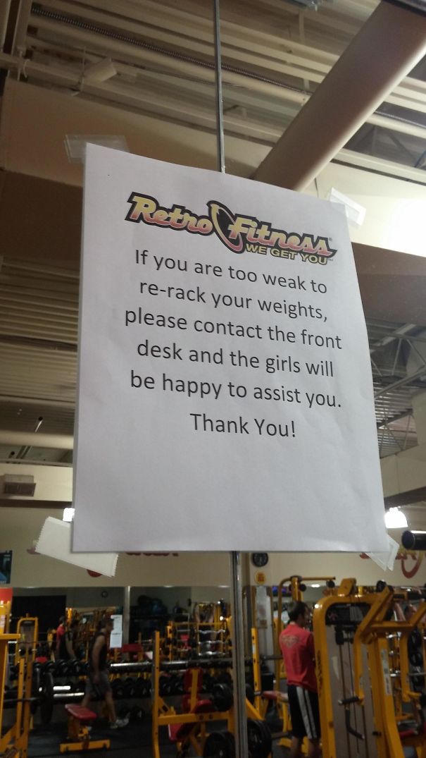 a note asking visitors to re-rack weights 