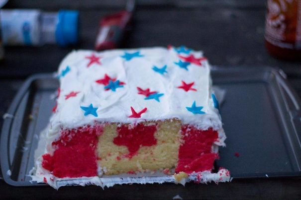 a USA themed cake with Canadian flag inside 