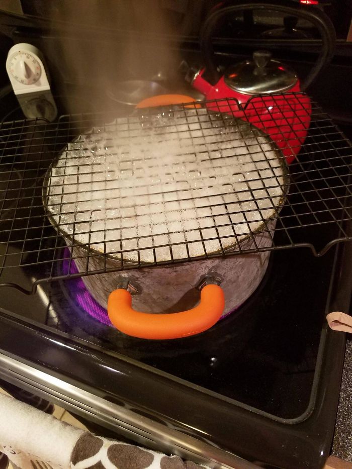 Forget The Wooden Spoon, Here's A Lifehack That Actually Works: Wire Cooling Rack