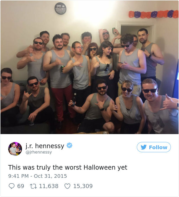 group of people dressed the same in the grey shirt wearing sunglasses 