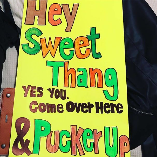 Funny airport pickup sign with colorful text: "Hey Sweet Thang, yes you. Come over here & pucker up."