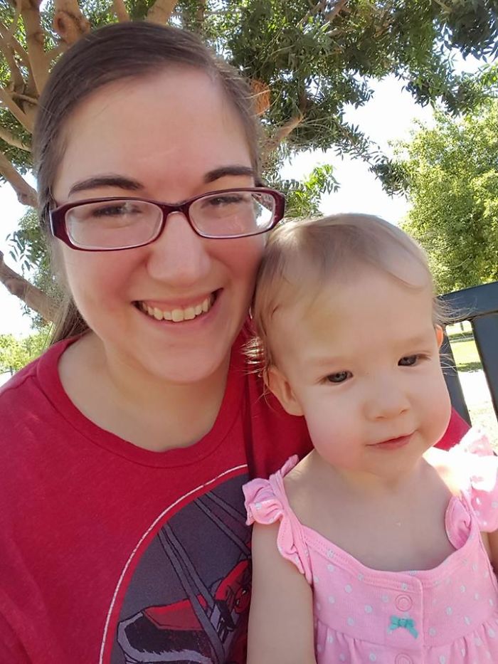 Woman and child smiling outdoors, illustrating that depression symptoms have no face.