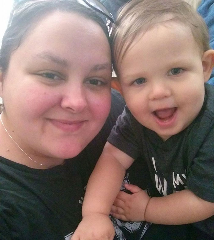 Smiling woman with a child, demonstrating that depression symptoms have no face.
