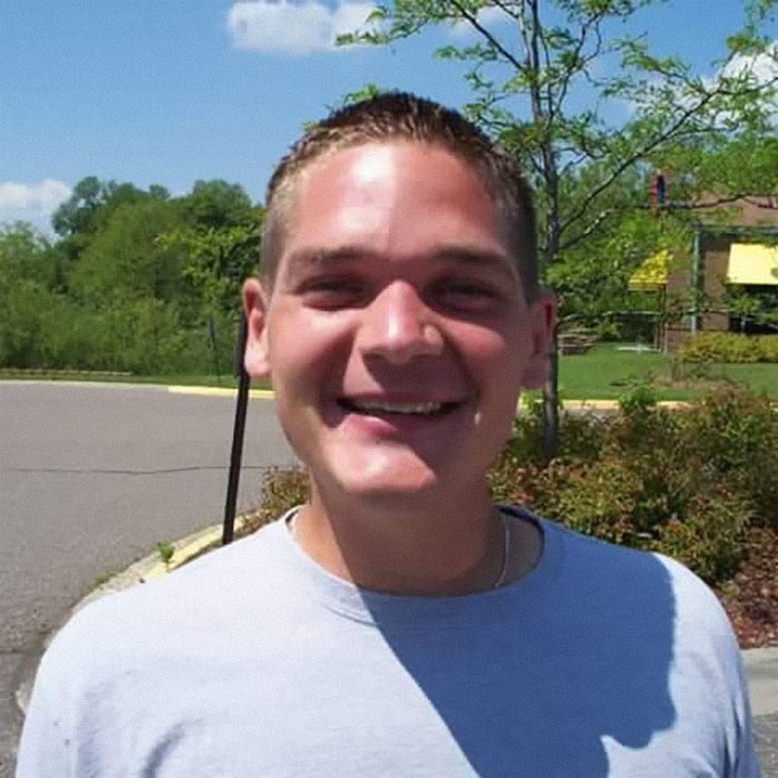 Smiling person outdoors on a sunny day, illustrating that depression symptoms have no face.