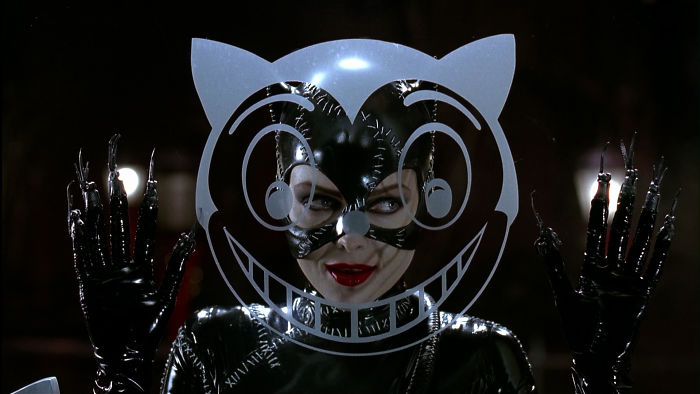 Scene from Batman Returns movie showing Catwoman in a black costume, related to fun facts about movies keyword.