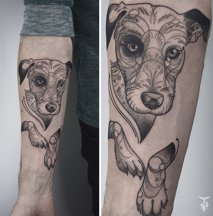 Nature and art nouveau inspired tattoo of a dog's face and paws on a person's arm.