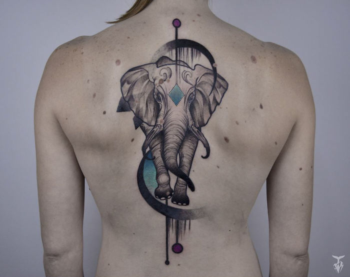 Back tattoo of an elephant design inspired by nature and art nouveau.