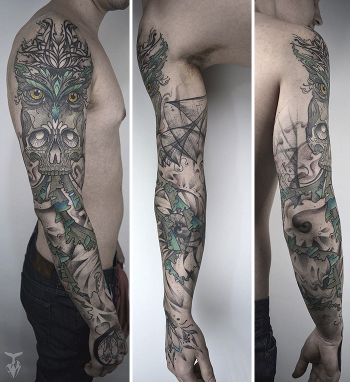 Tattoo sleeve featuring art nouveau and nature-inspired designs on a man's arm.