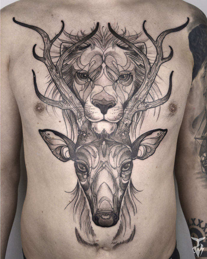 Chest tattoo featuring nature and art nouveau elements with a lion and deer design.