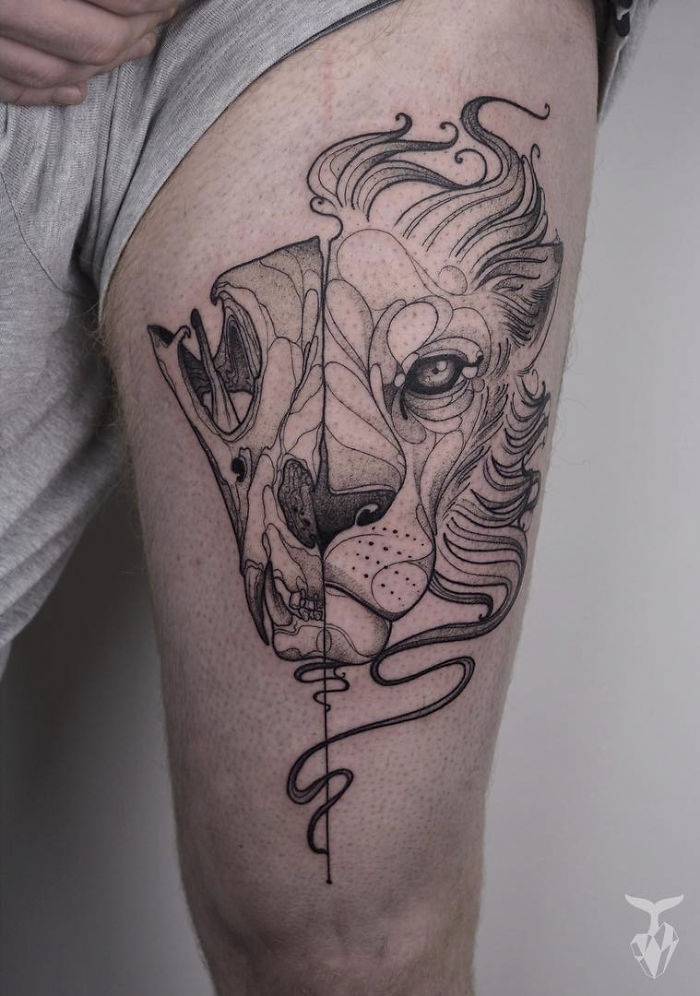 Nature and Art Nouveau inspired tattoo on thigh, featuring a lion and skull design in black ink.