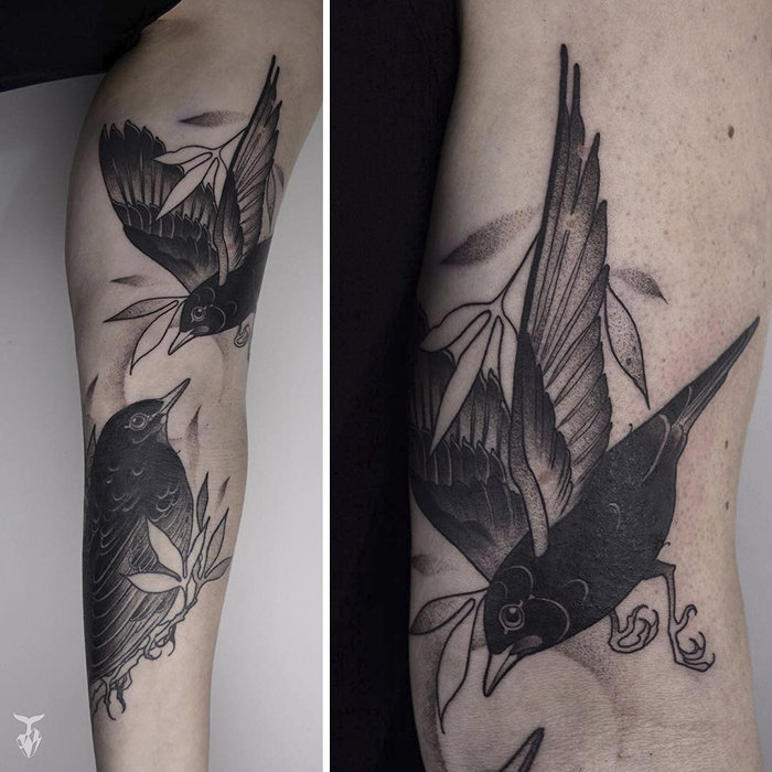 Nature and Art Nouveau inspired bird tattoo with detailed leaves and shading.