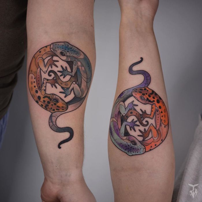 Art Nouveau inspired tattoos featuring colorful gecko designs on forearms.