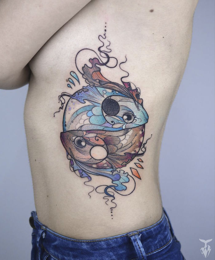 Nature and Art Nouveau inspired tattoo of colorful fish on a person's side.