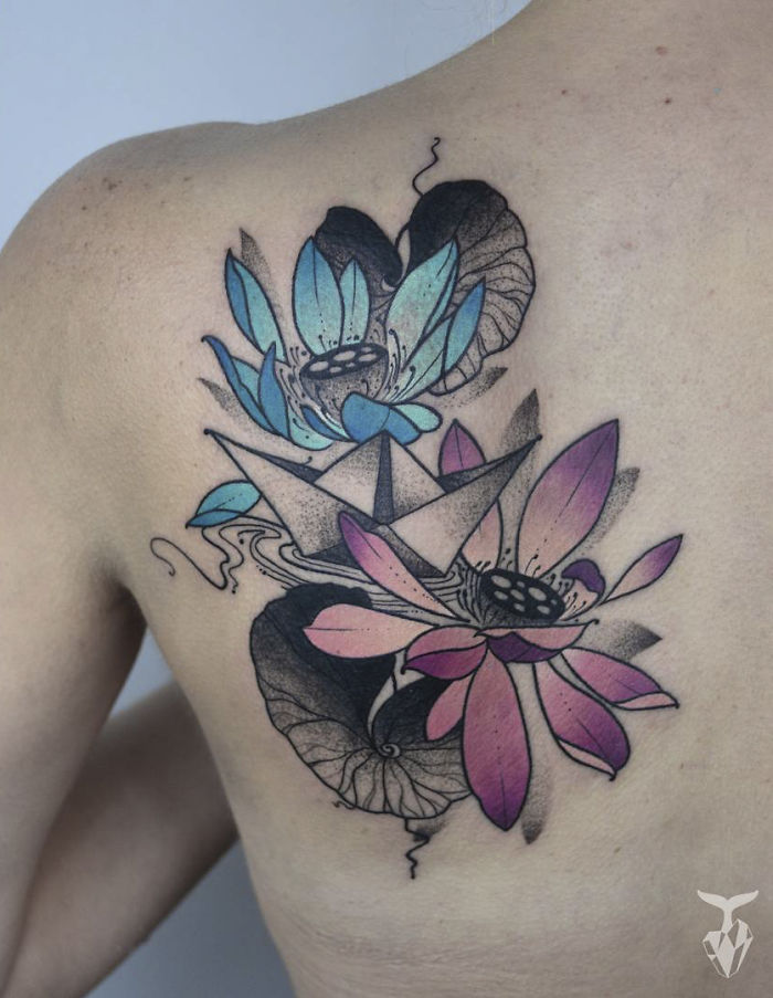 Nature and Art Nouveau inspired tattoo featuring colorful flowers on back.