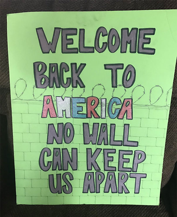 Funny airport pickup sign with text "Welcome back to America, no wall can keep us apart."