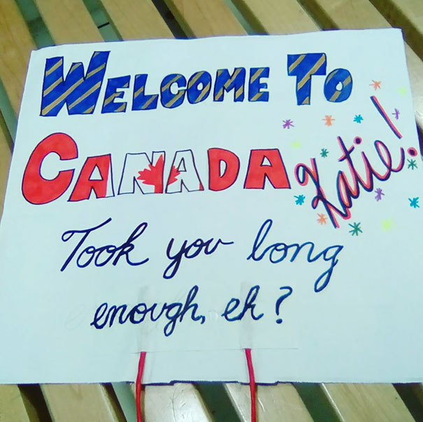 Funny airport pickup sign welcoming Katie to Canada with humor.