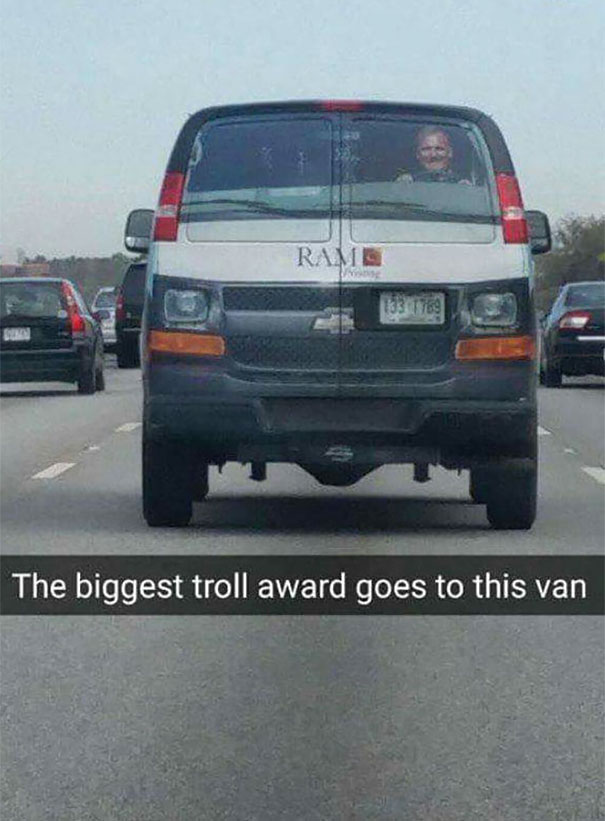 a van with bumper sticker with driver on the back