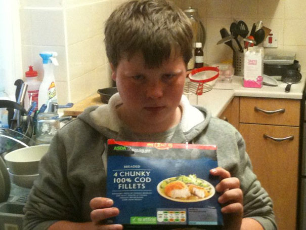 a kid holding cod fillers instead of a cod for xbox 