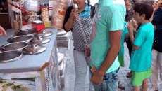 man fooling around with an ice cream 