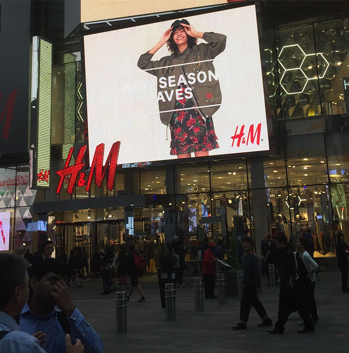 White Text On An Off White Background... On Their Flagship Store In Times Square