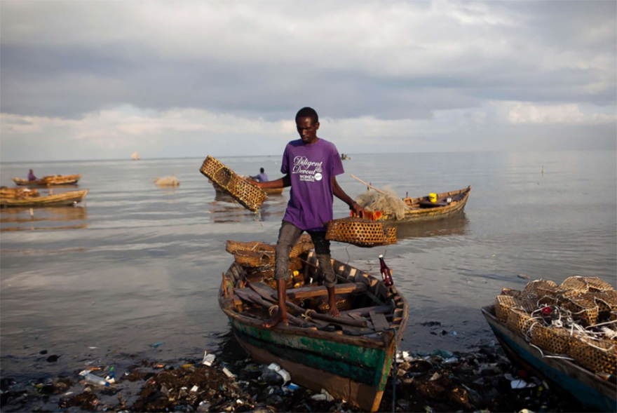 A Fisherman Removes Equipment From His Wooden Boat As A Precaution Against Hurricane Irma, In Port-au-prince, Haiti