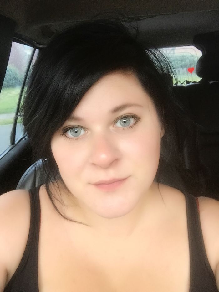 Person in a car, looking at the camera, highlighting that depression symptoms have no face.