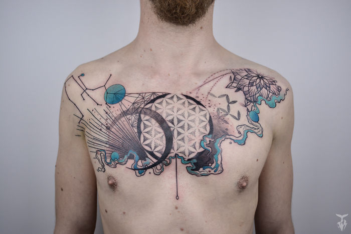Chest tattoo featuring nature and Art Nouveau elements, with geometric patterns and organic shapes.