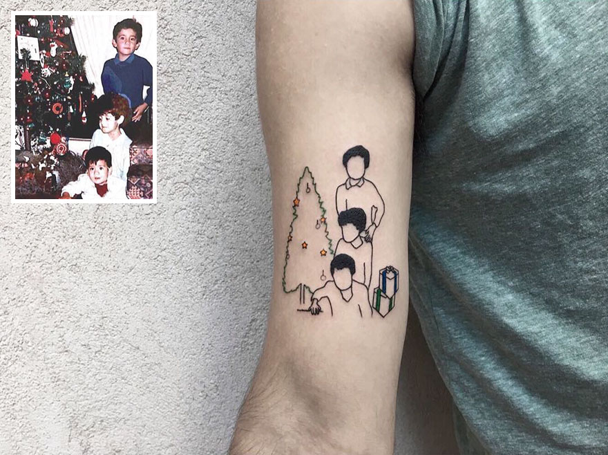 Tattoo of childhood photo on arm, featuring three children by a Christmas tree with presents, highlighting nostalgic tattoos.